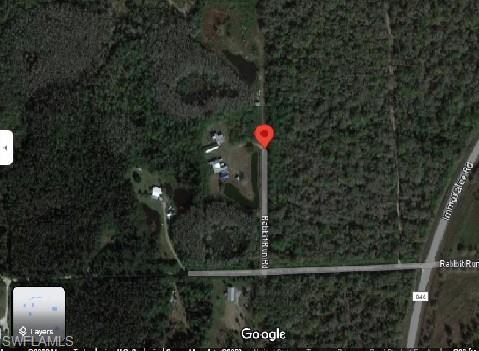 725 Rabbit Run Road Naples, FL 34120 - Photo 4 of 4 a front view of a house with a yard