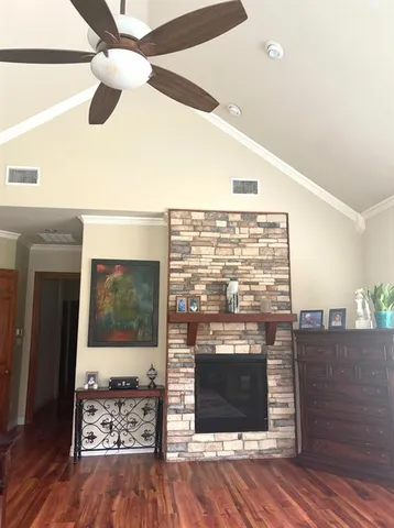 a very nice looking living room with a fireplace and a flat screen tv