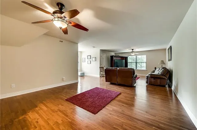 a living room with furniture and a rug