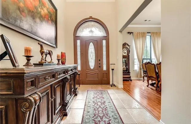 a view of a entryway door with furniture