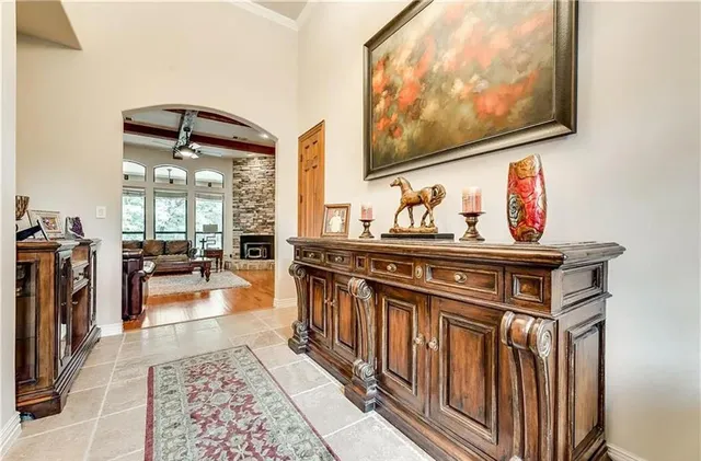a hallway with wooden floor and furniture