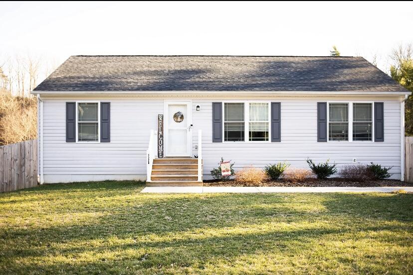a front view of a house with a yard