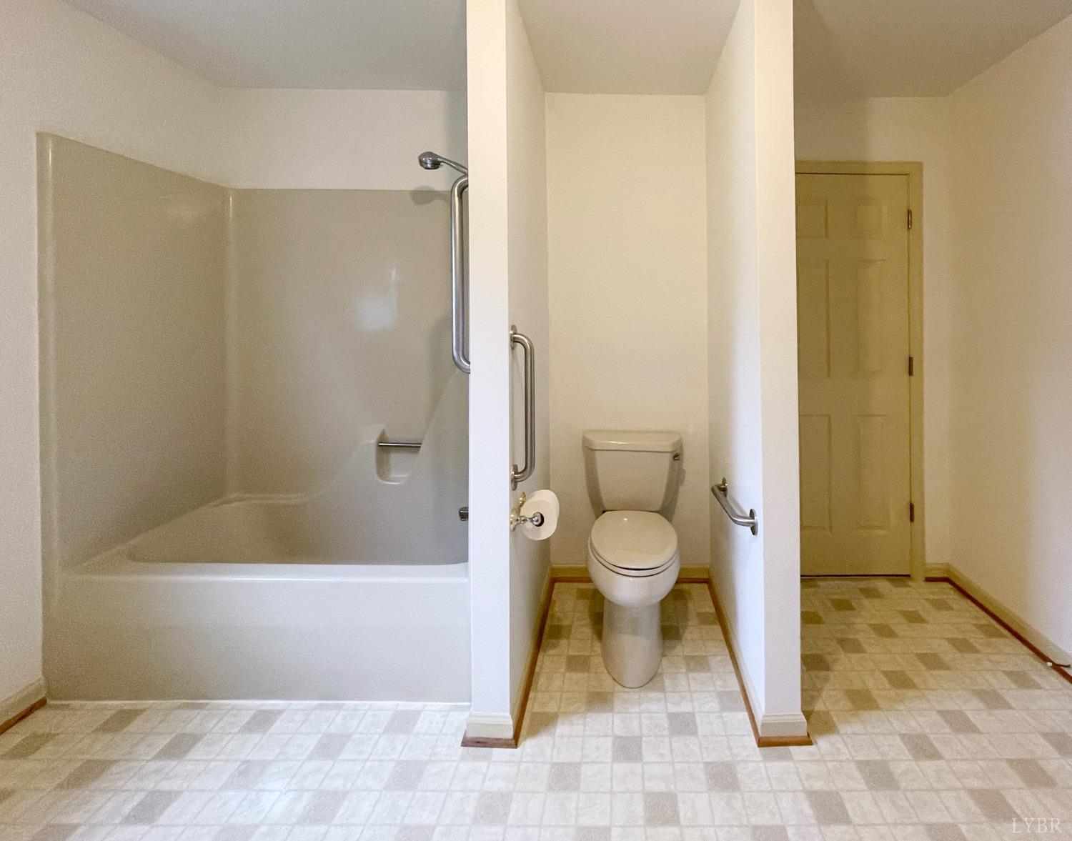 1714 Goode Road Goode, VA 24556 - Photo 10 of 25 a bathroom with a toilet and a shower