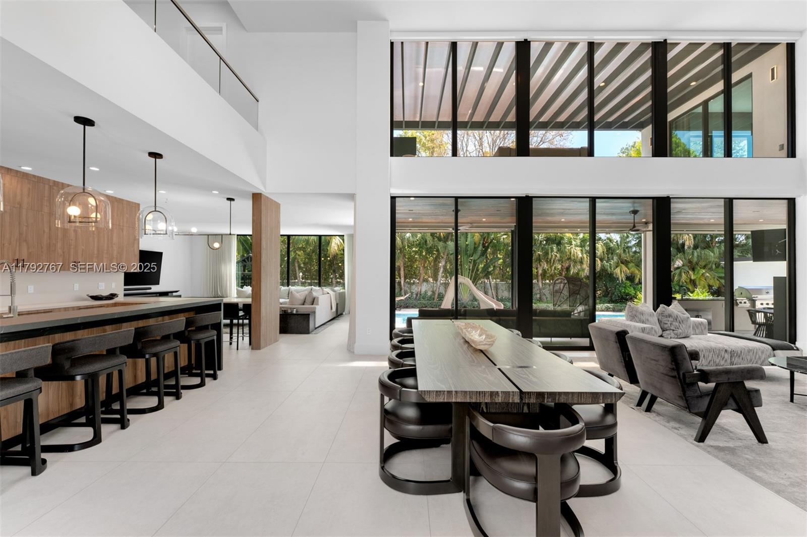 13180 Old Cutler Road Pinecrest, FL 33156 - Photo 18 of 66 a view of a dining area with furniture window and outside view