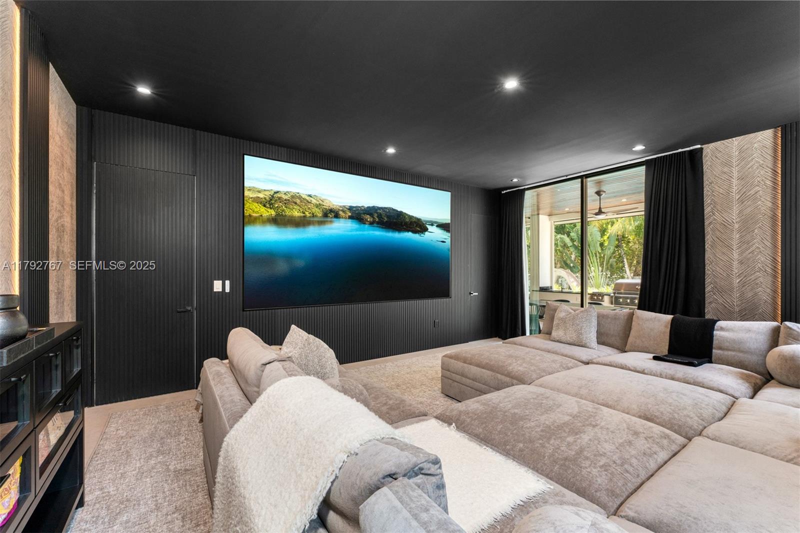 13180 Old Cutler Road Pinecrest, FL 33156 - Photo 20 of 66 a bedroom with furniture and a flat screen tv