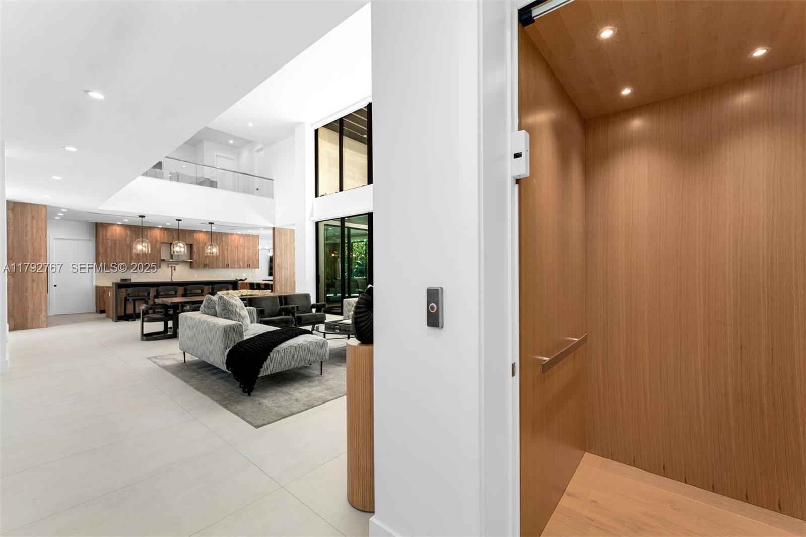 13180 Old Cutler Road Pinecrest, FL 33156 - Photo 25 of 66 a living room with furniture and a chandelier