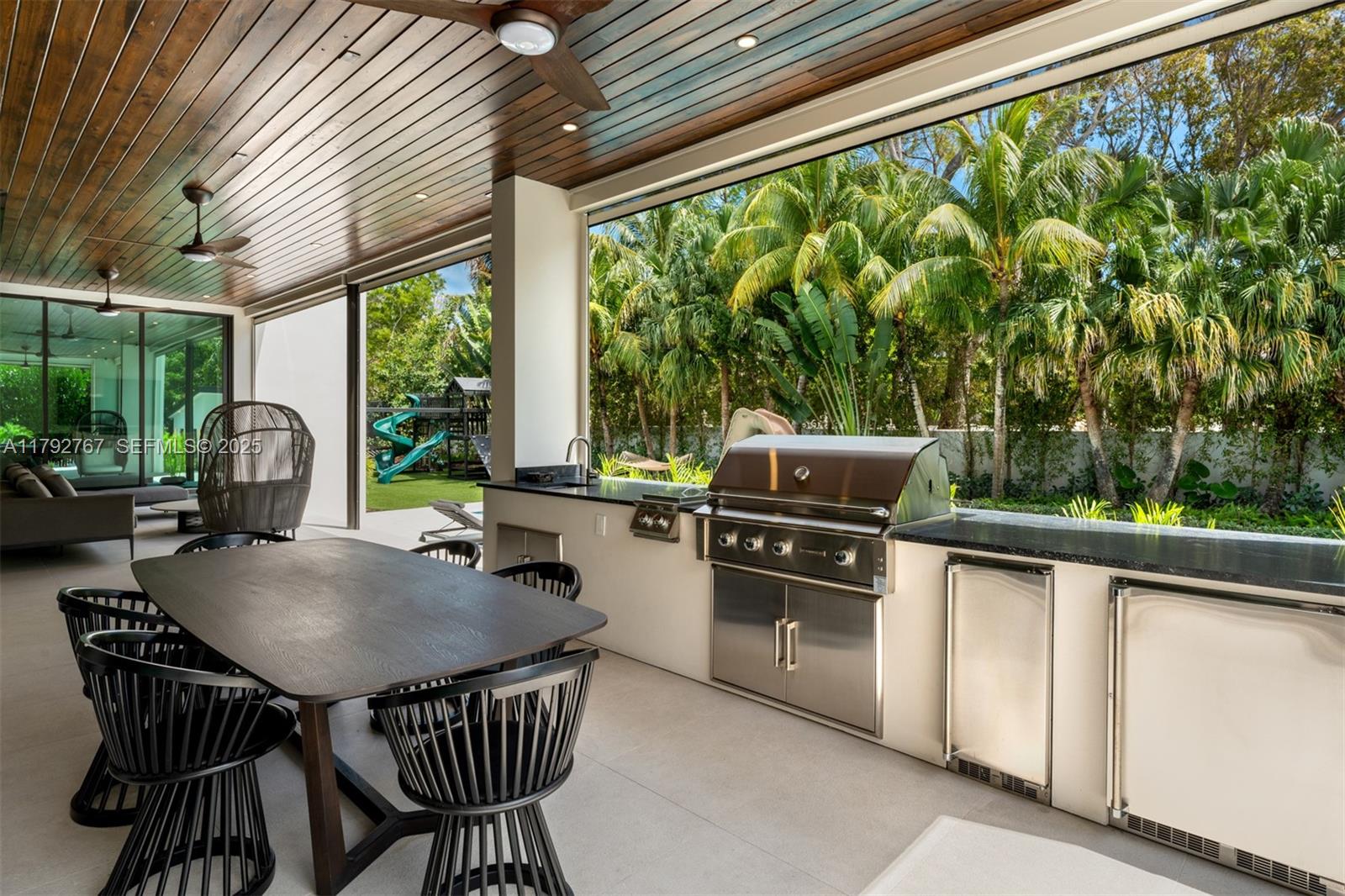 13180 Old Cutler Road Pinecrest, FL 33156 - Photo 40 of 66 a outdoor dining space with furniture and garden view