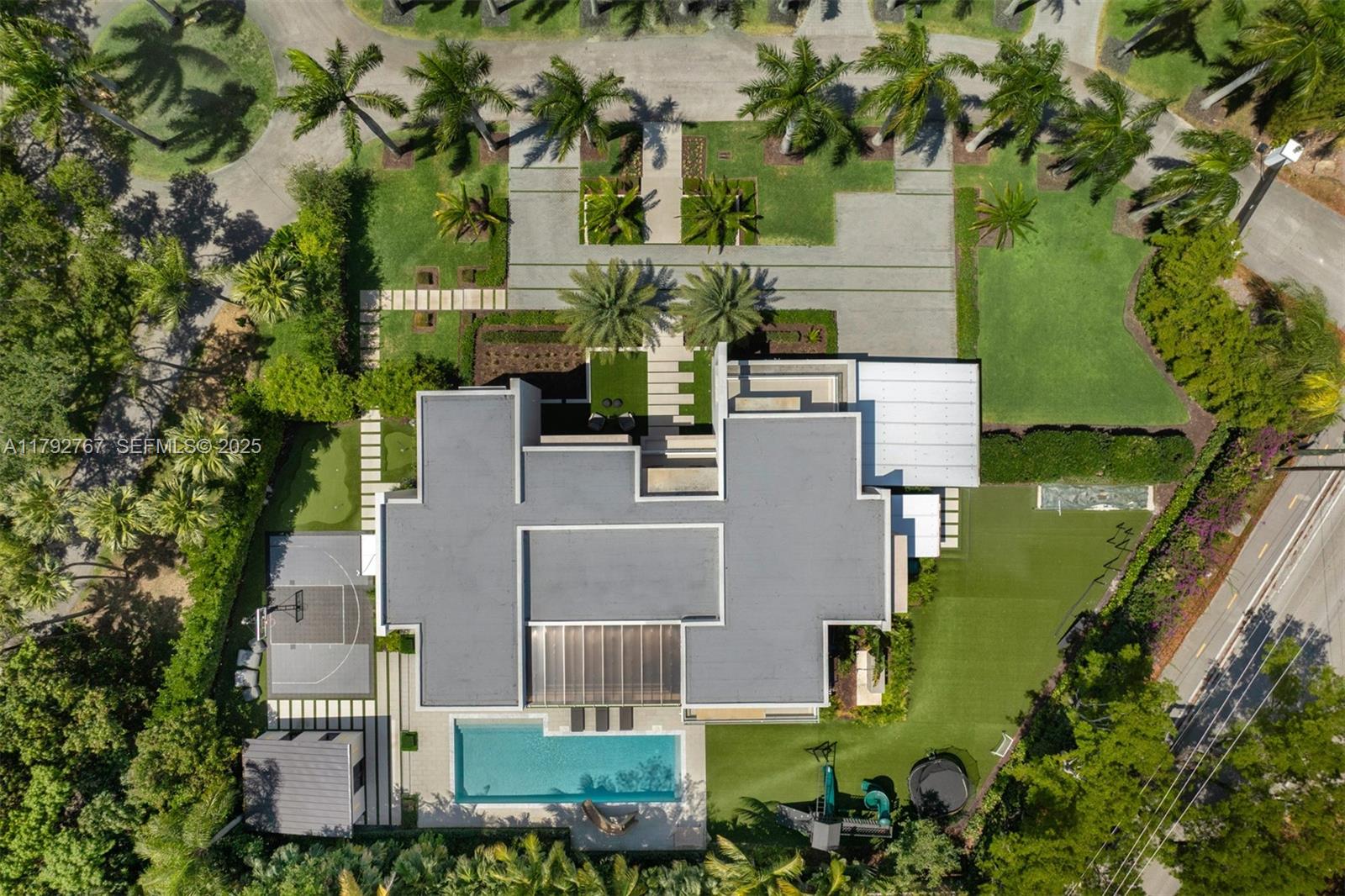 13180 Old Cutler Road Pinecrest, FL 33156 - Photo 53 of 66 an aerial view of a house with outdoor space pool seating area and yard