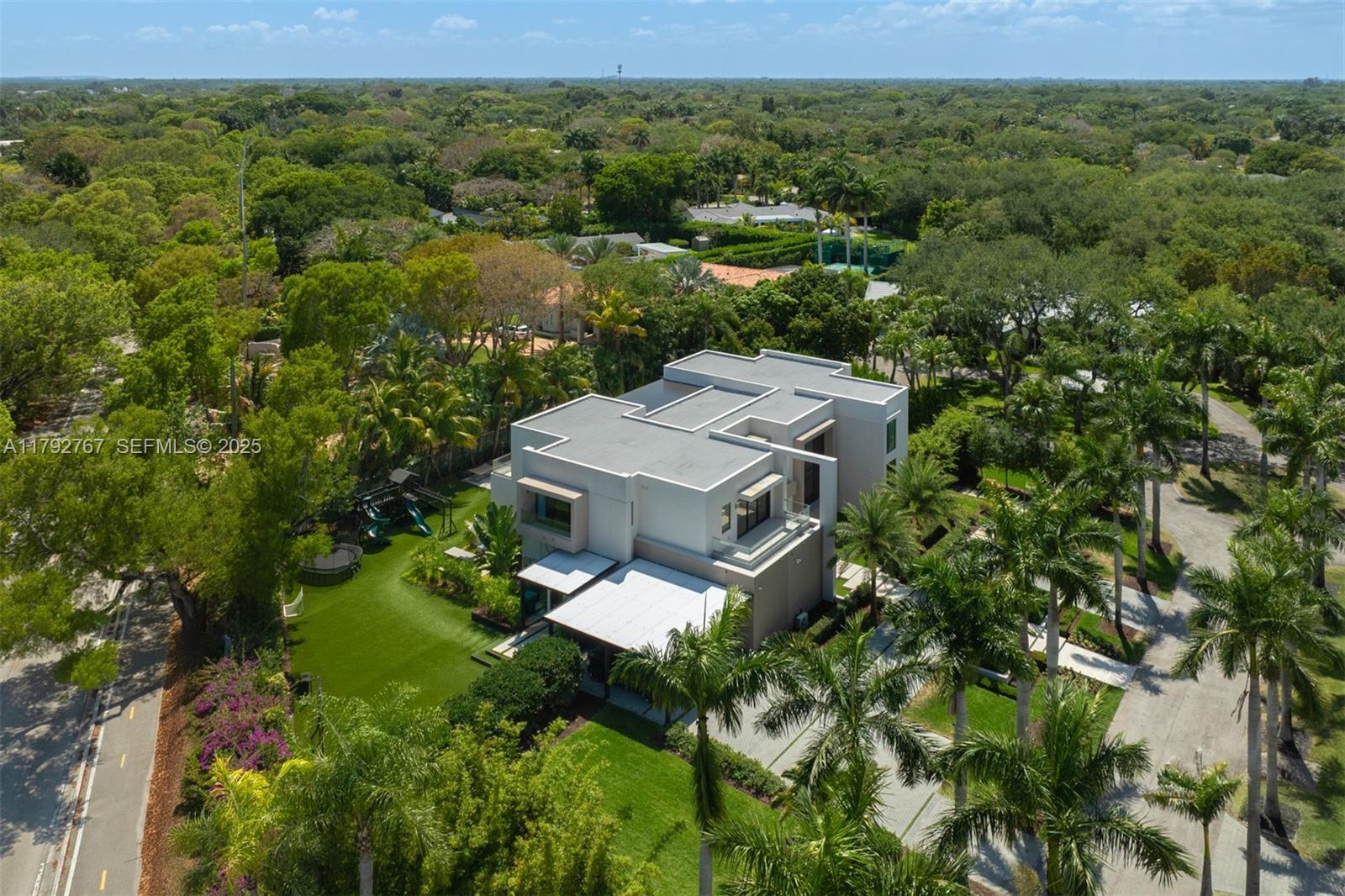 13180 Old Cutler Road Pinecrest, FL 33156 - Photo 54 of 66 an aerial view of a house with a yard