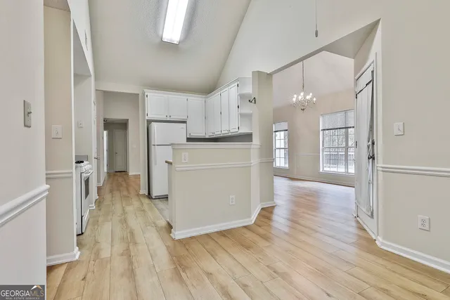 a view of a kitchen with wooden floor