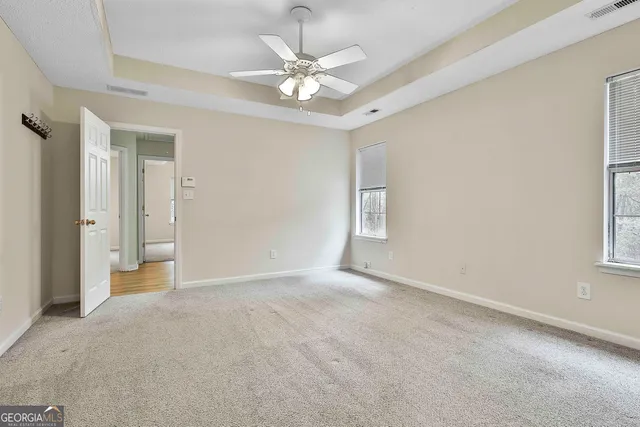 a view of an empty room with a window