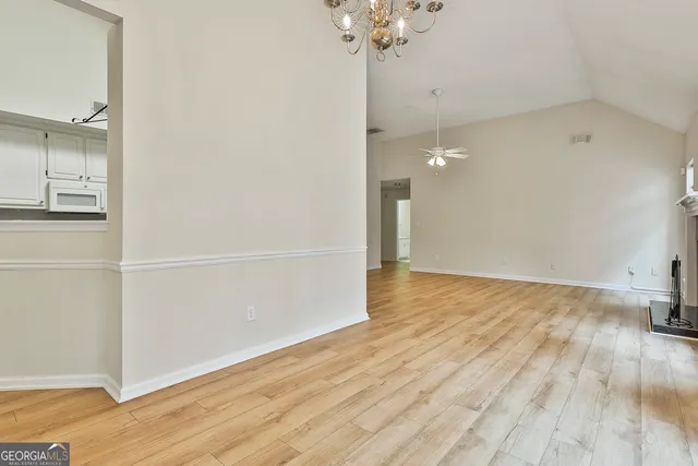 a view of a room with wooden floor and cabinet