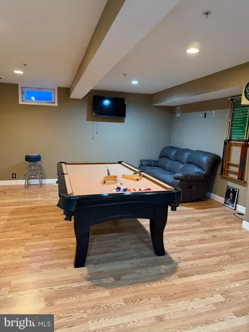 a room with furniture and pool table