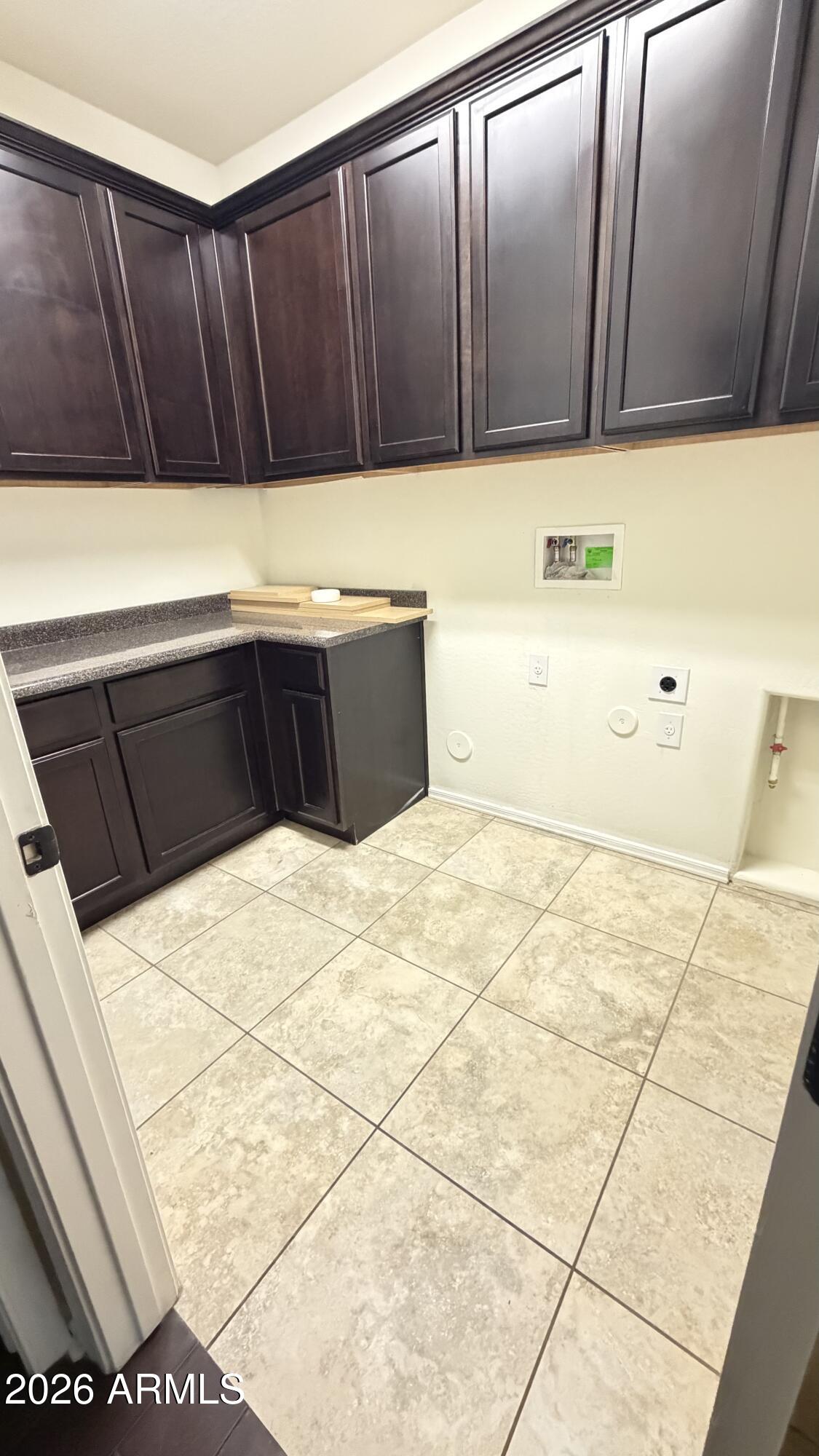 10786 West Yearling Road Peoria, AZ 85383 - Photo 14 of 21 a kitchen with wooden cabinets