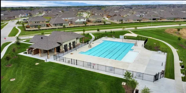 an aerial view of a house with a garden