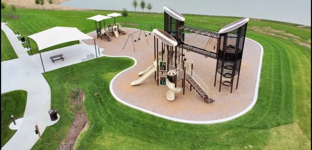 an aerial view of a house with a yard and trees