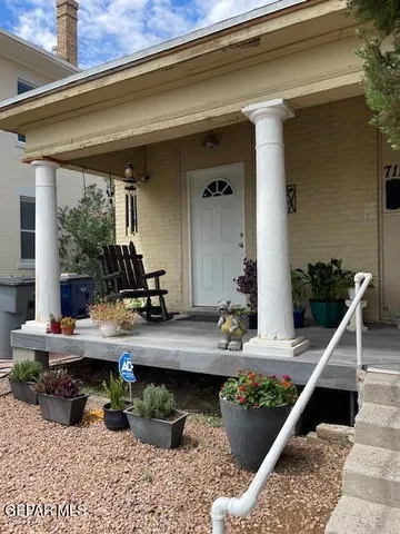 a view of a house with large windows