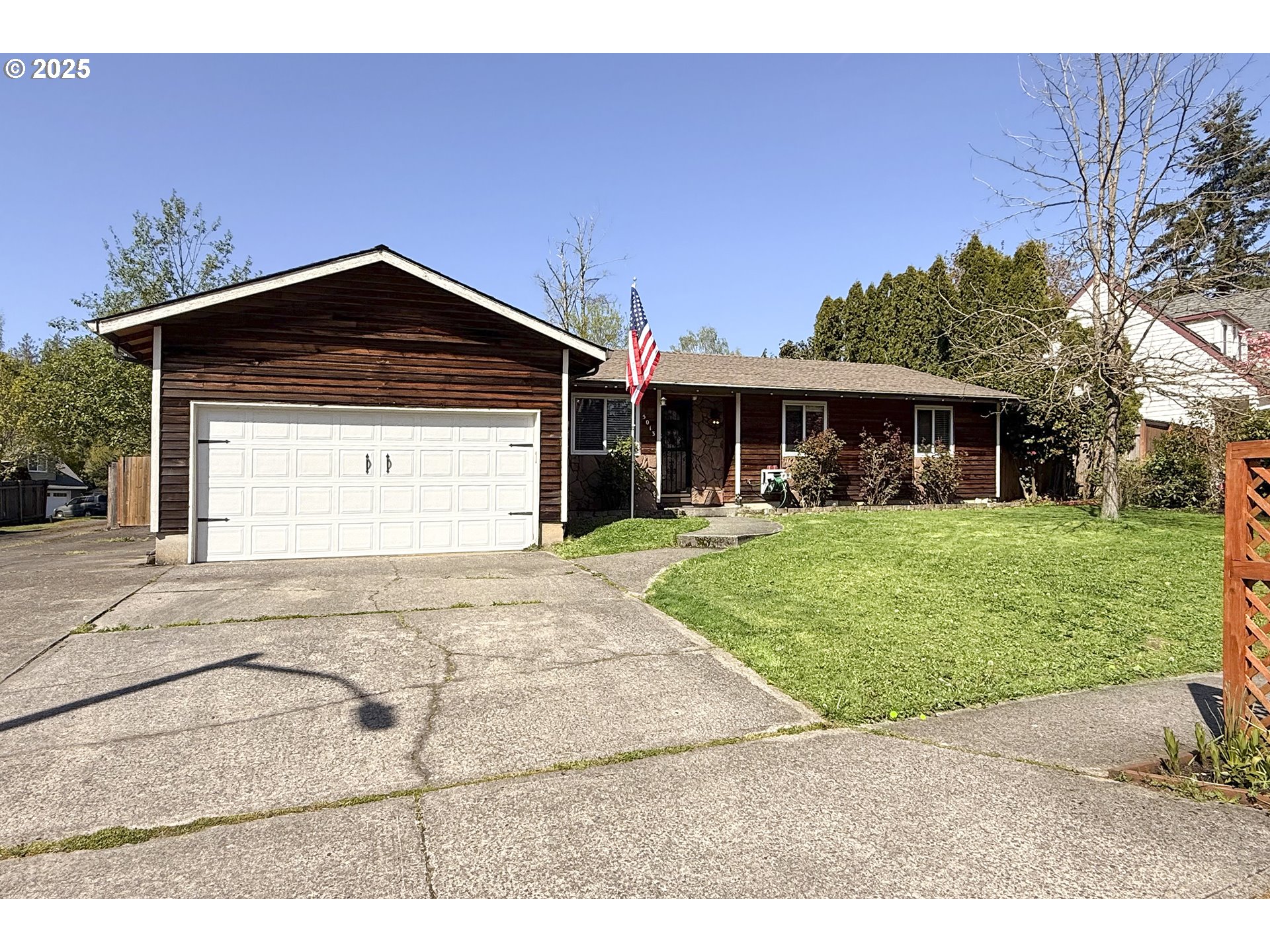 5013 Southeast 22nd Street Gresham, OR 97080 - Photo 1 of 38 a front view of a house with a yard
