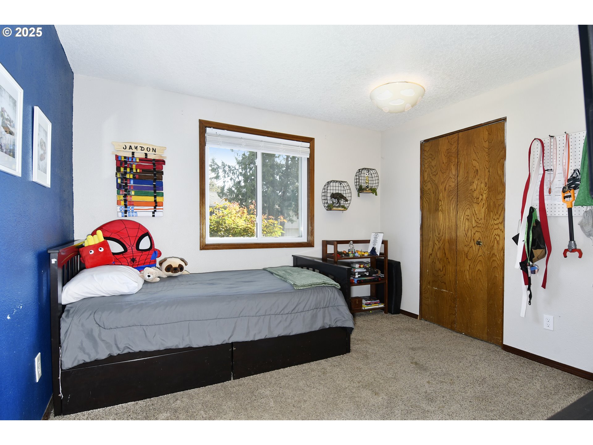 5013 Southeast 22nd Street Gresham, OR 97080 - Photo 16 of 38 a bedroom with a bed a dresser and a window
