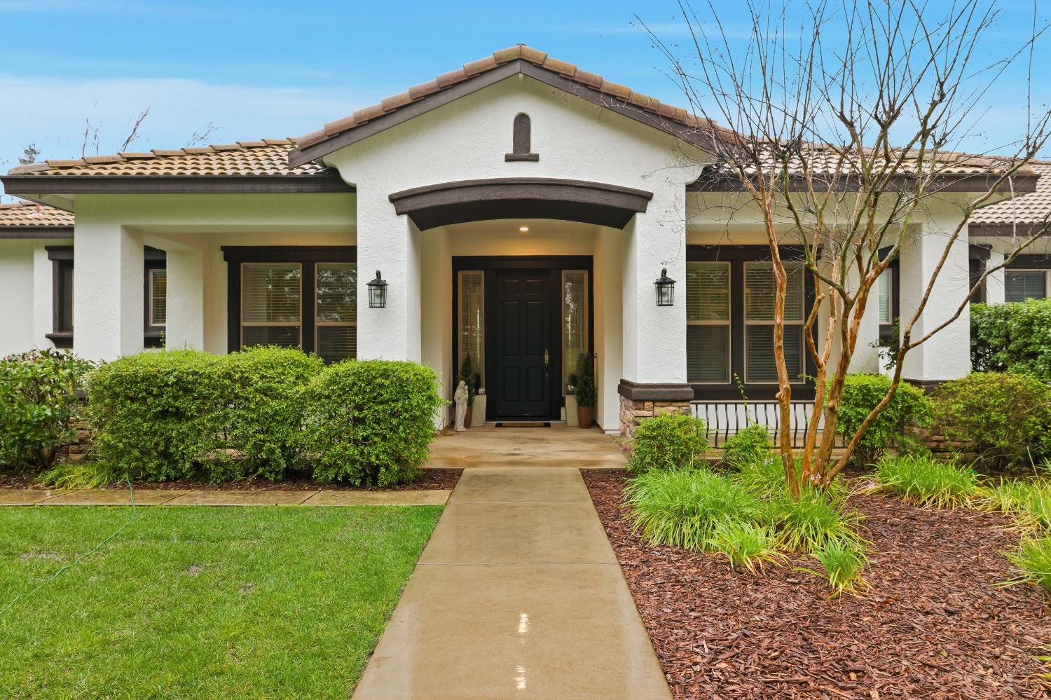 12800 Rimfire Drive Wilton, CA 95693 - Photo 1 of 1 a front view of a house with a yard