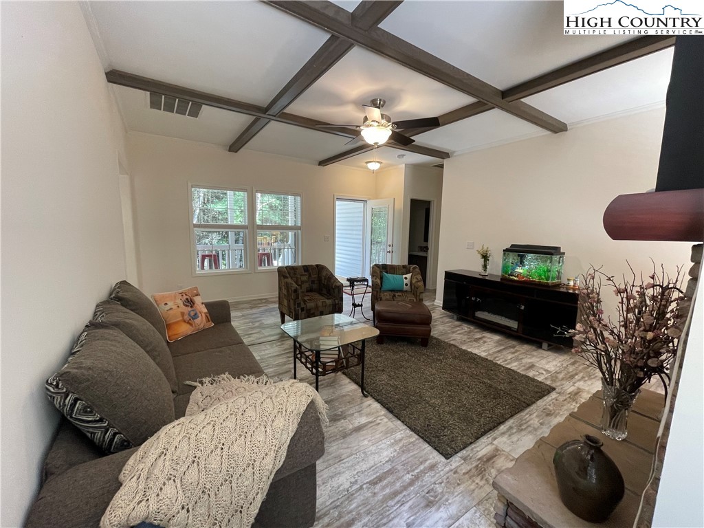227 Meadow Pines Trail Boone, NC 28607 - Photo 18 of 34 a living room with furniture and a flat screen tv