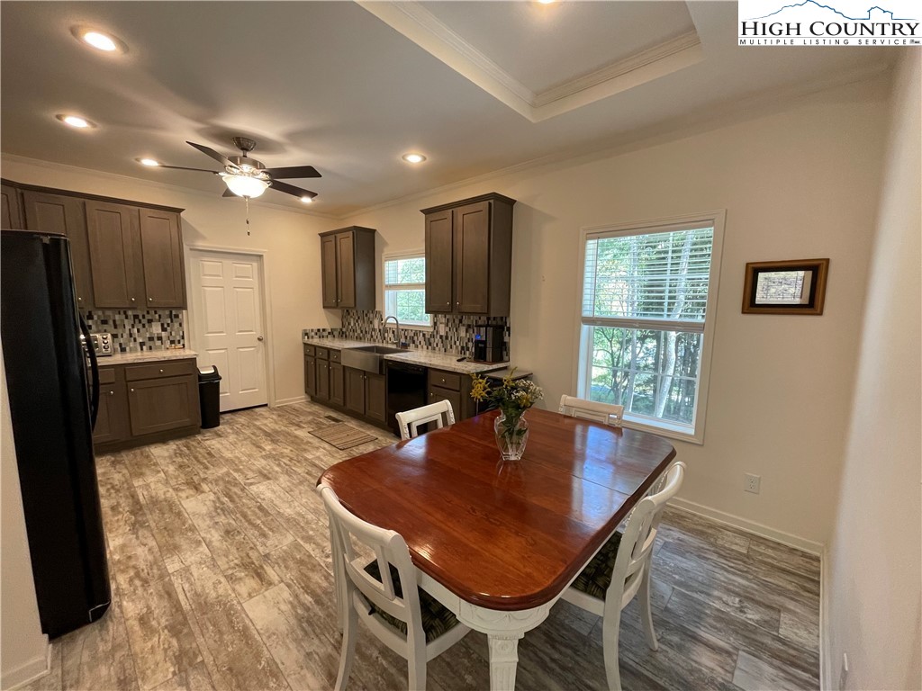 227 Meadow Pines Trail Boone, NC 28607 - Photo 20 of 34 a kitchen with kitchen island a dining table and chairs