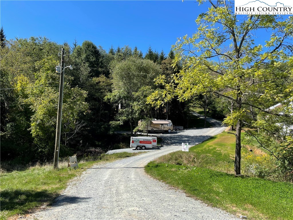 227 Meadow Pines Trail Boone, NC 28607 - Photo 2 of 34 a view of a bench in a garden