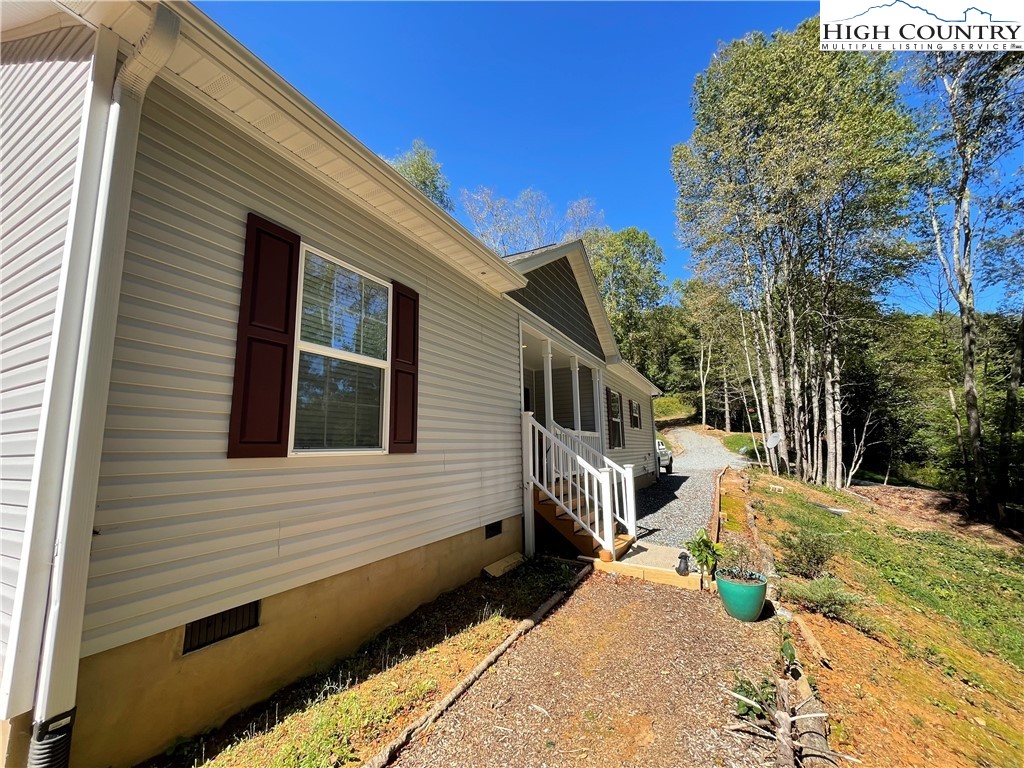 227 Meadow Pines Trail Boone, NC 28607 - Photo 7 of 34 a view of a house with a yard