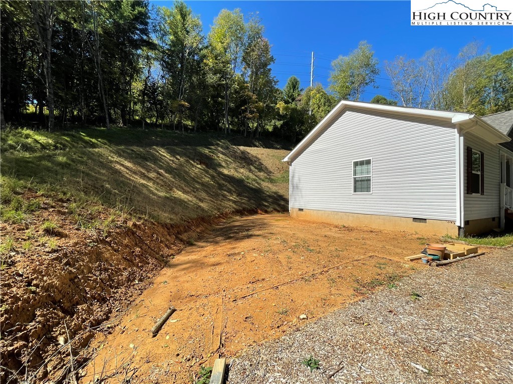 227 Meadow Pines Trail Boone, NC 28607 - Photo 9 of 34 a view of a house with a yard