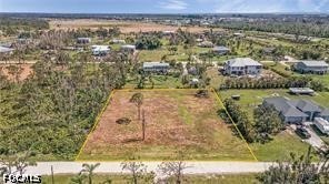 4695 Gulf Shore Road St. James City, FL 33956 - Photo 1 of 13 an aerial view of residential houses with outdoor space
