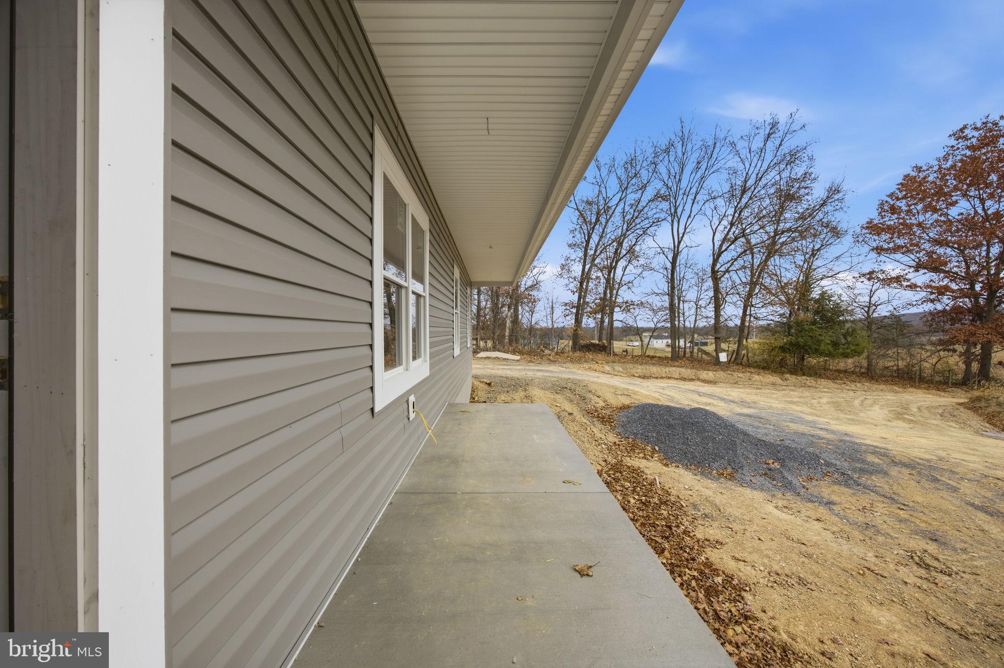 629 Providence Church Road Hedgesville, WV 25427 - Photo 11 of 54 a view of a pathway of a house with a yard