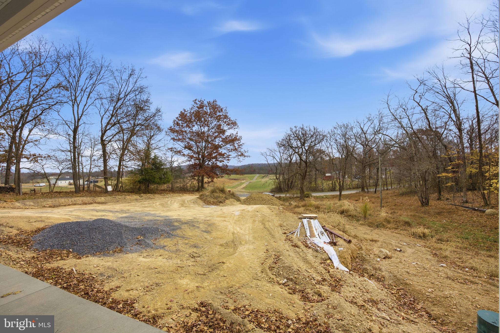 629 Providence Church Road Hedgesville, WV 25427 - Photo 13 of 54 a view of a yard with snow on the road