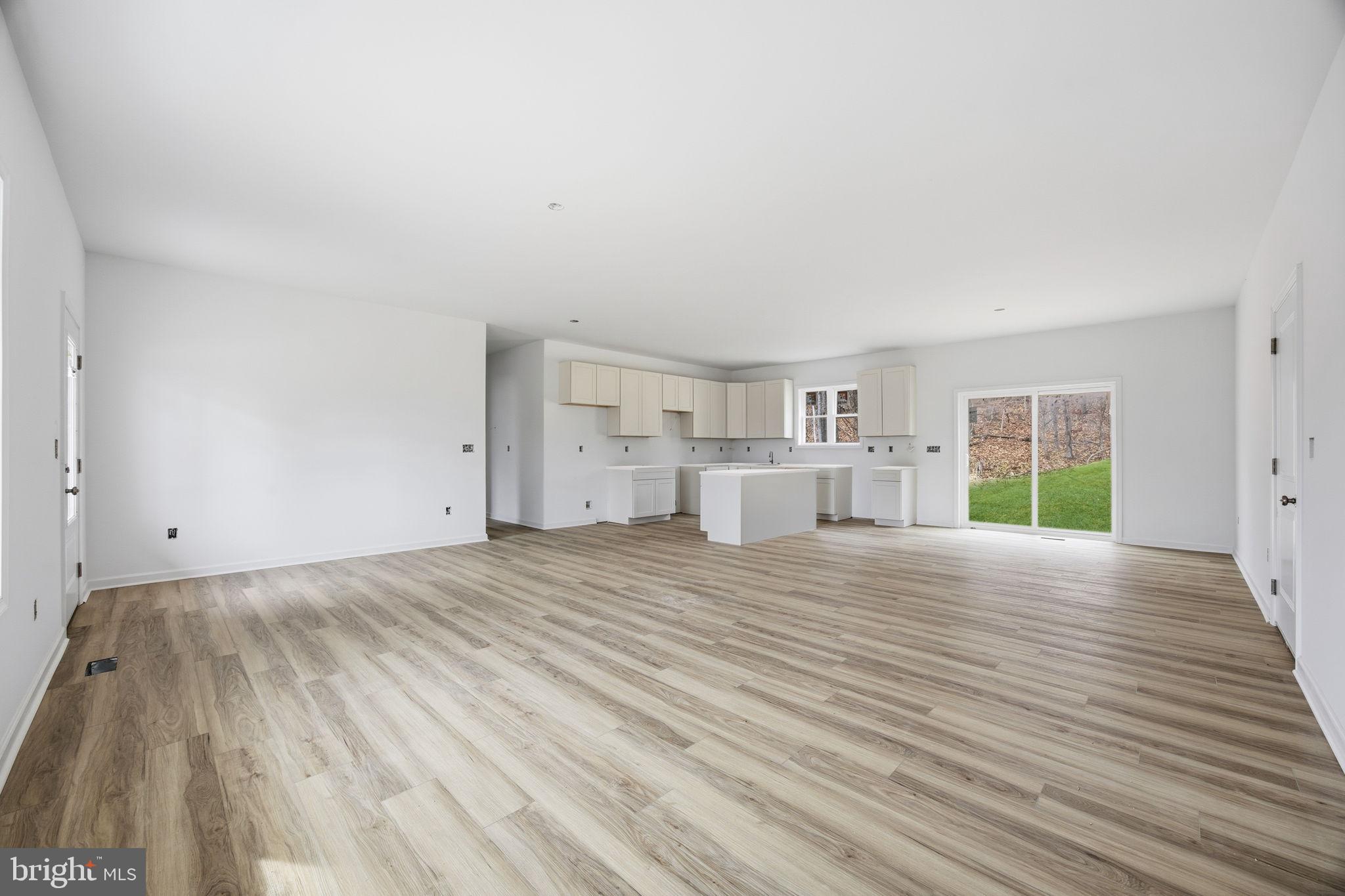 629 Providence Church Road Hedgesville, WV 25427 - Photo 15 of 54 a view of empty room with wooden floor and window