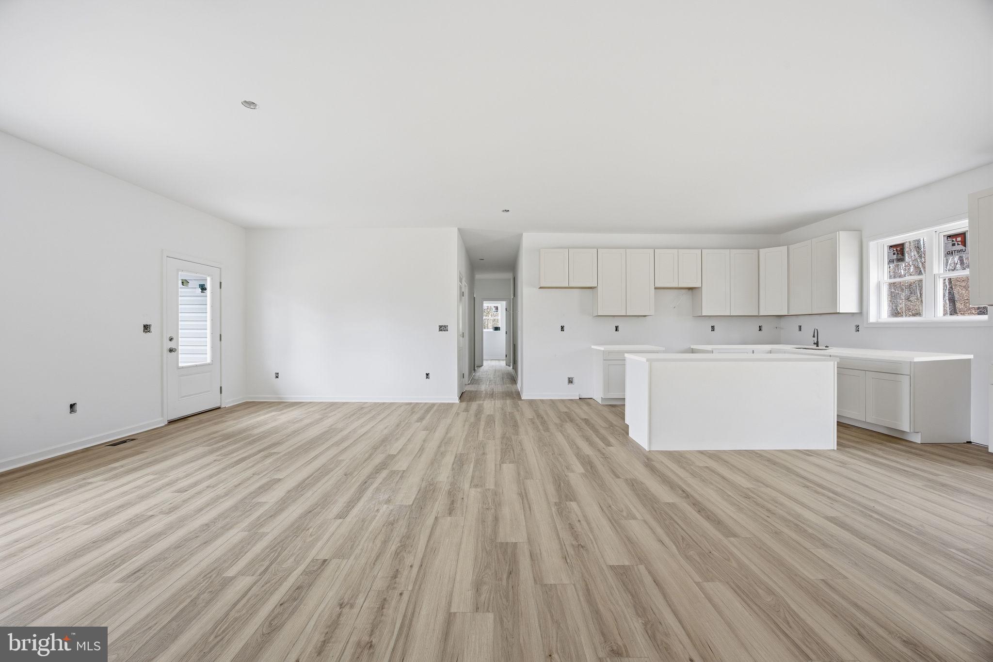 629 Providence Church Road Hedgesville, WV 25427 - Photo 16 of 54 a view of a kitchen with wooden floor and electronic appliances
