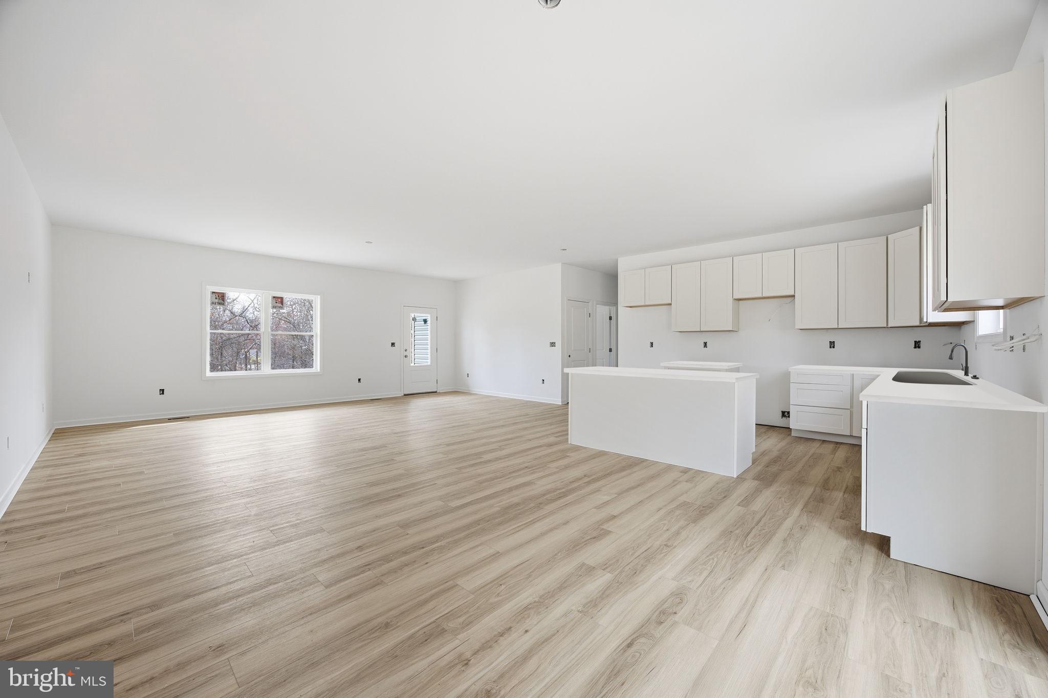 629 Providence Church Road Hedgesville, WV 25427 - Photo 17 of 54 a view of a kitchen with window and wooden floor
