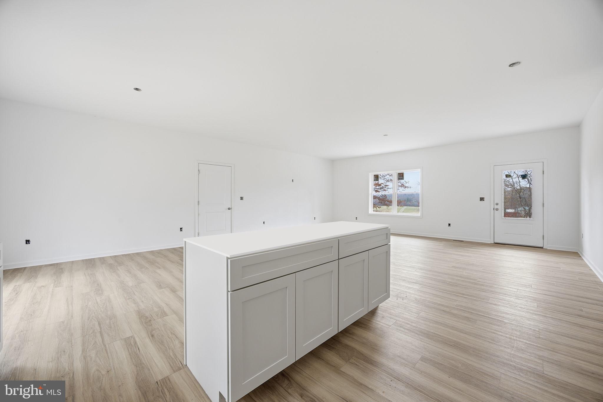 629 Providence Church Road Hedgesville, WV 25427 - Photo 18 of 54 a view of a kitchen with wooden floors and stairs
