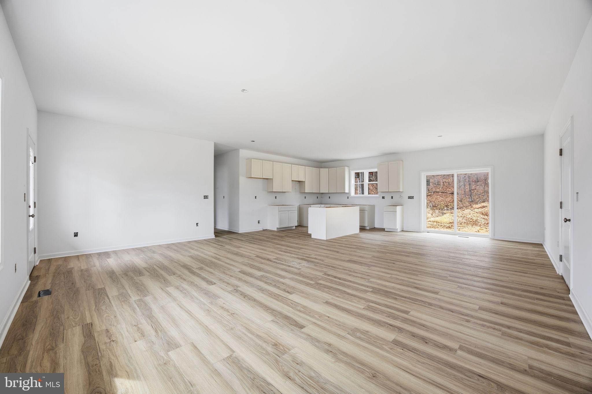 629 Providence Church Road Hedgesville, WV 25427 - Photo 23 of 54 a view of empty room with wooden floor and window