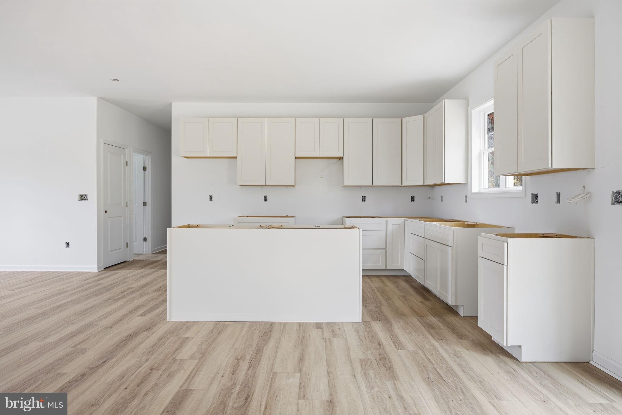 629 Providence Church Road Hedgesville, WV 25427 - Photo 25 of 54 a utility room with cabinets washer and dryer