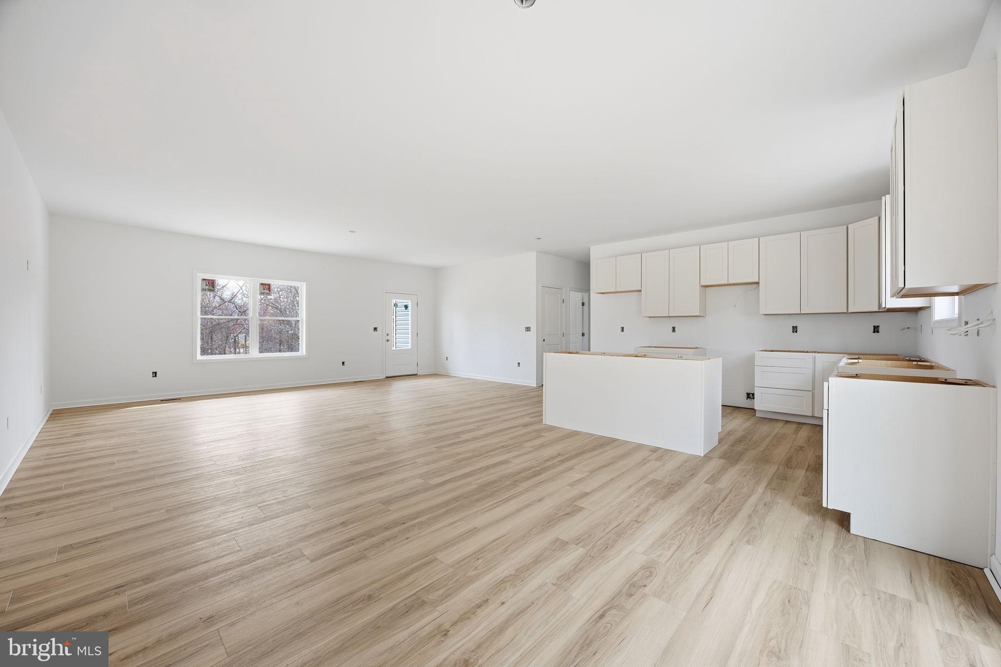 629 Providence Church Road Hedgesville, WV 25427 - Photo 26 of 54 a view of a kitchen with wooden floor and electronic appliances