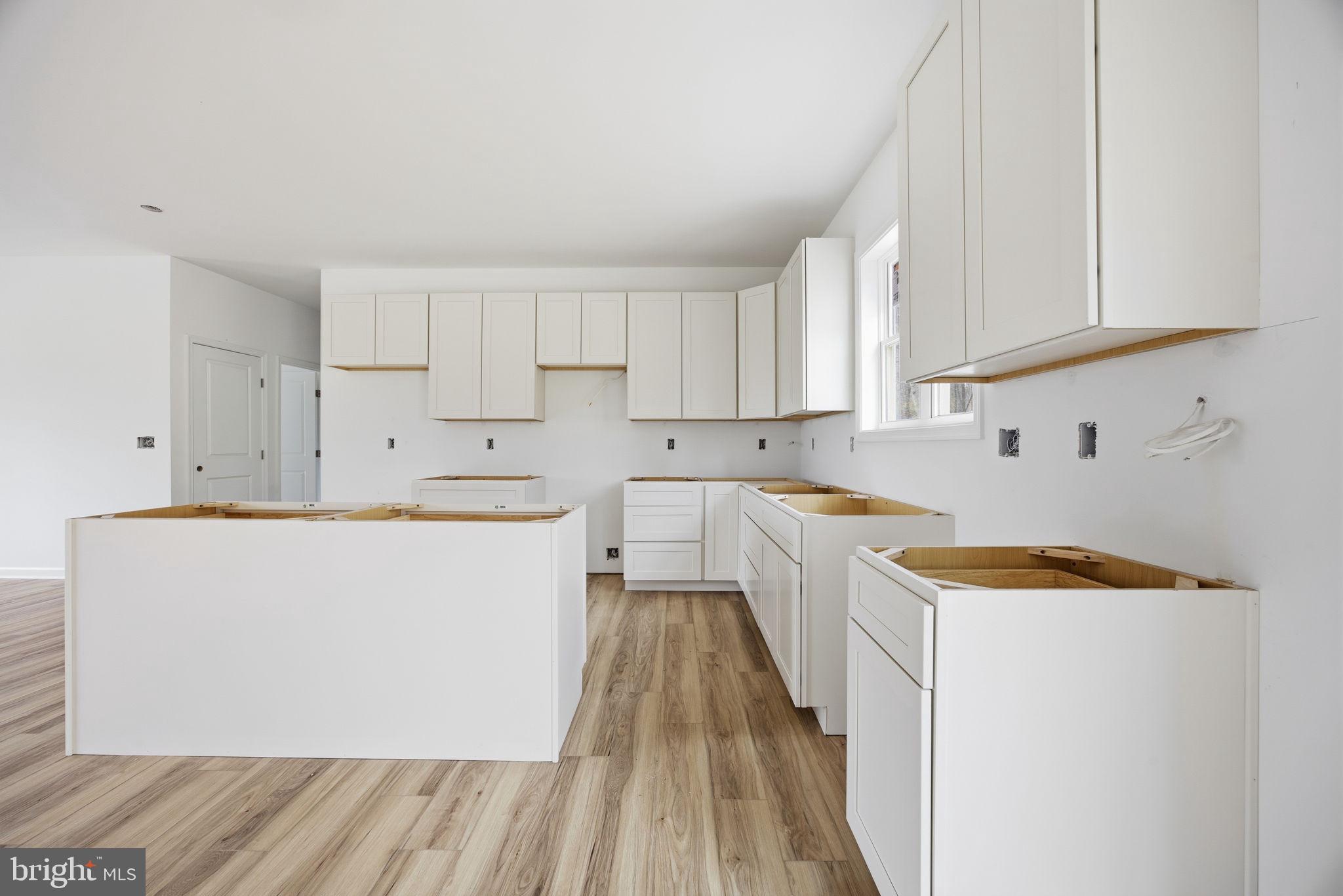 629 Providence Church Road Hedgesville, WV 25427 - Photo 27 of 54 a kitchen with cabinets a sink and dishwasher