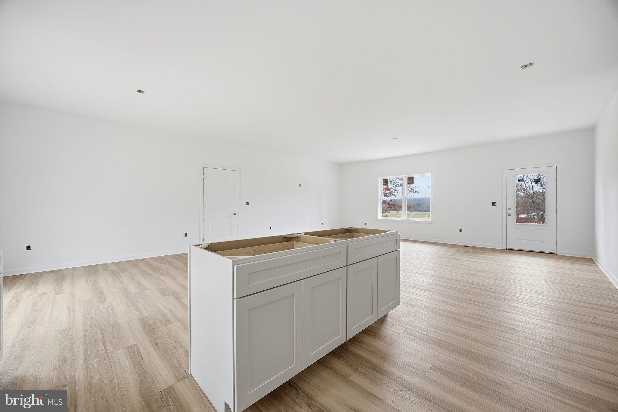 629 Providence Church Road Hedgesville, WV 25427 - Photo 28 of 54 a view of a kitchen with wooden floors and stairs