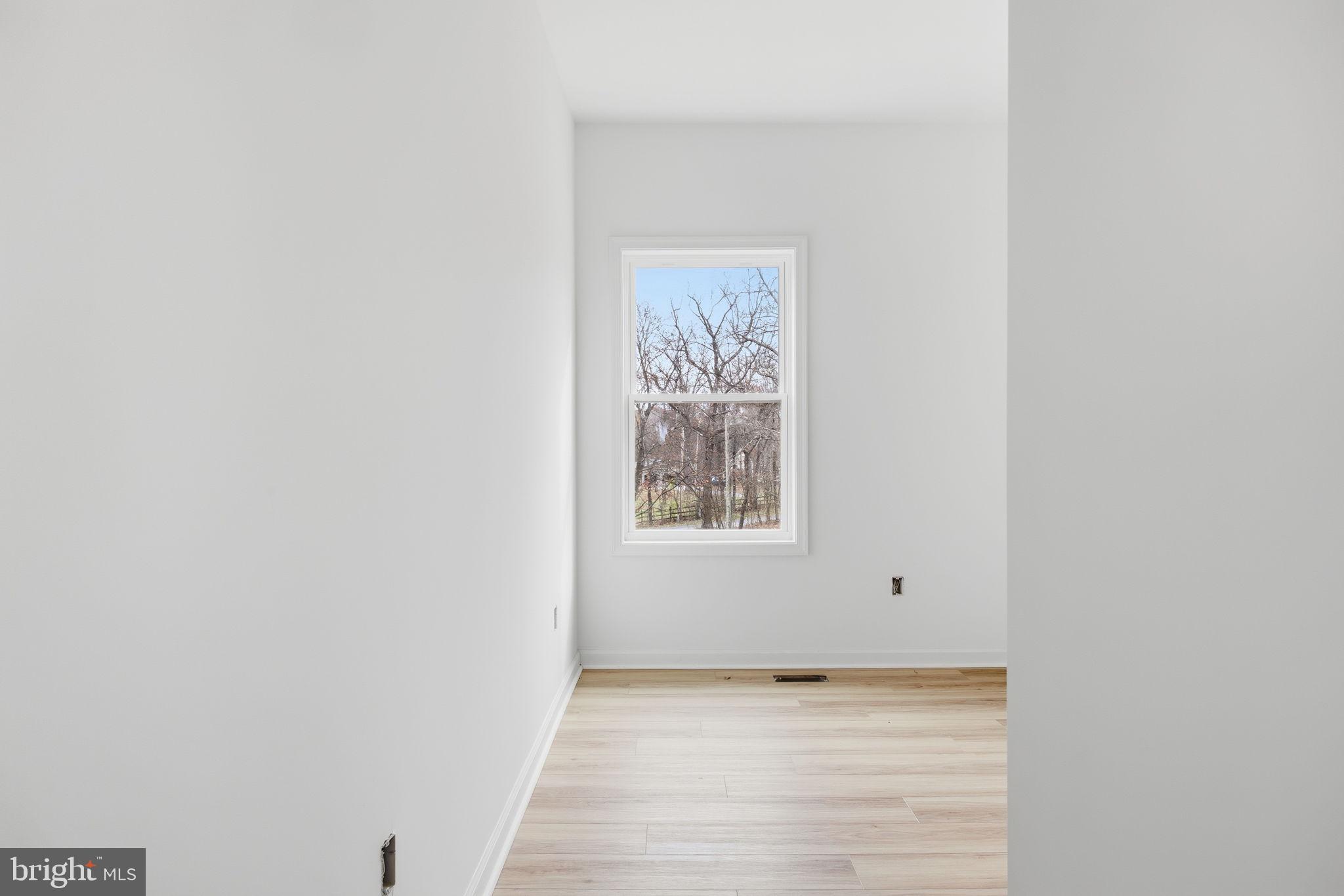 629 Providence Church Road Hedgesville, WV 25427 - Photo 31 of 54 a view of an empty room with a window