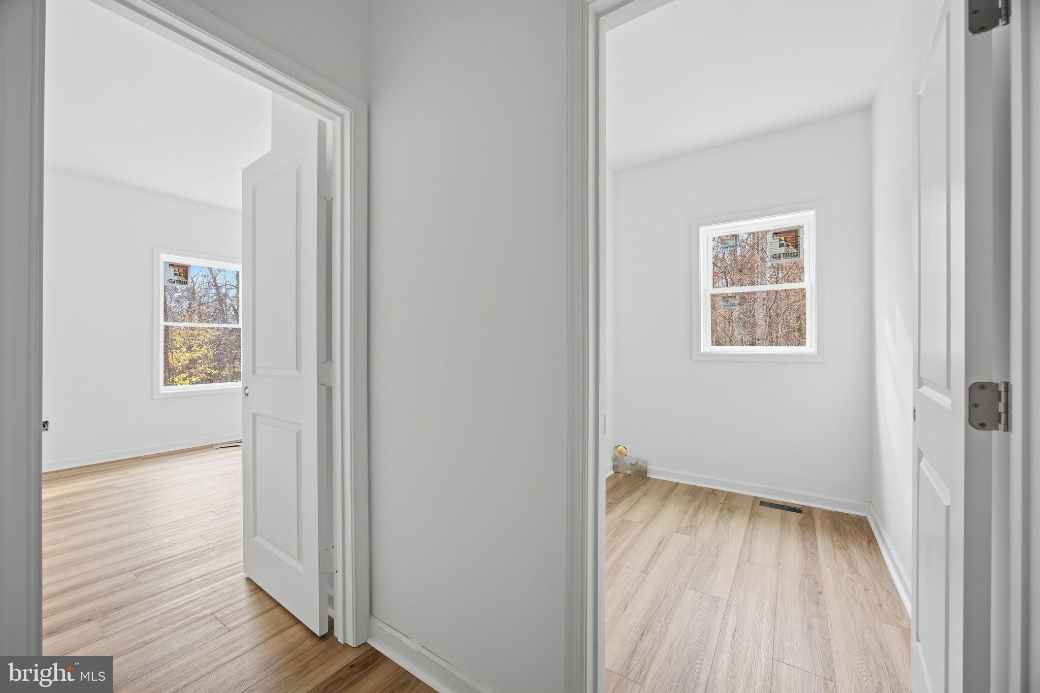 629 Providence Church Road Hedgesville, WV 25427 - Photo 34 of 54 a view of an empty room with wooden floor and a window