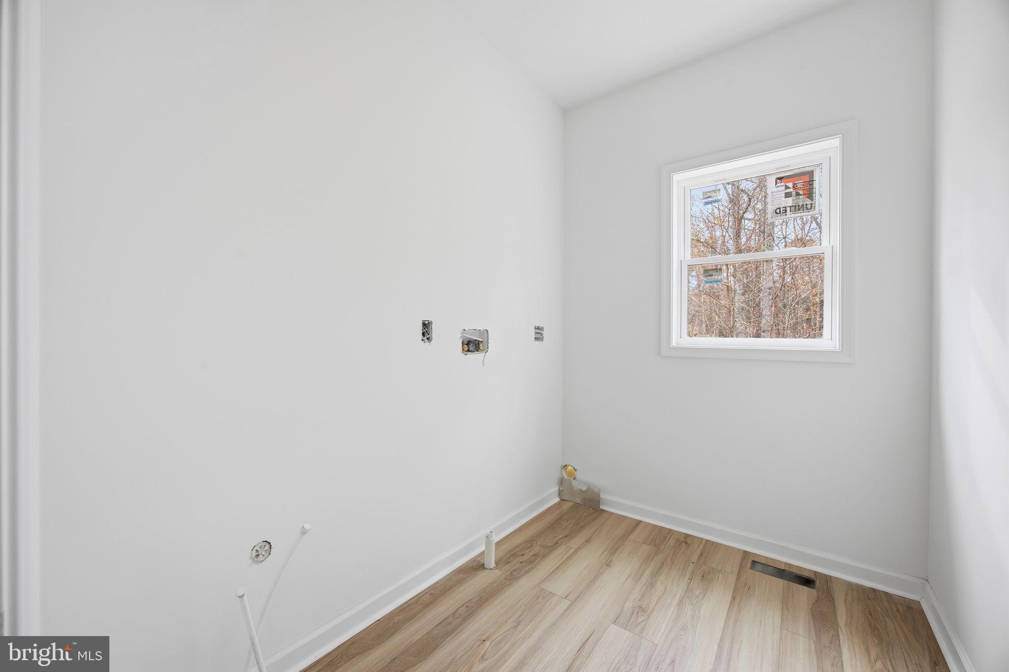 629 Providence Church Road Hedgesville, WV 25427 - Photo 38 of 54 a view of a small space with wooden floor and a window