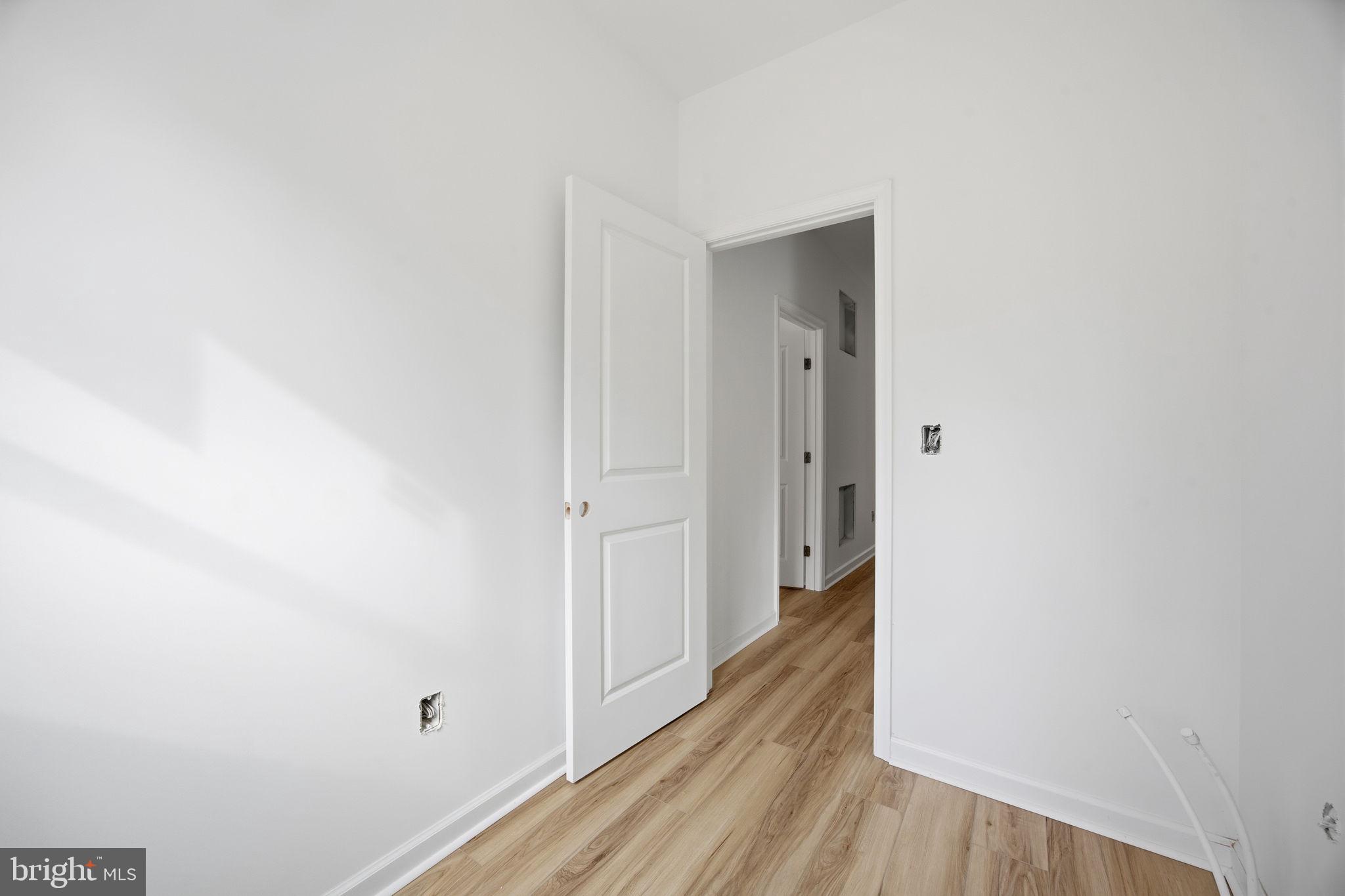 629 Providence Church Road Hedgesville, WV 25427 - Photo 39 of 54 a view of a hallway with wooden floor