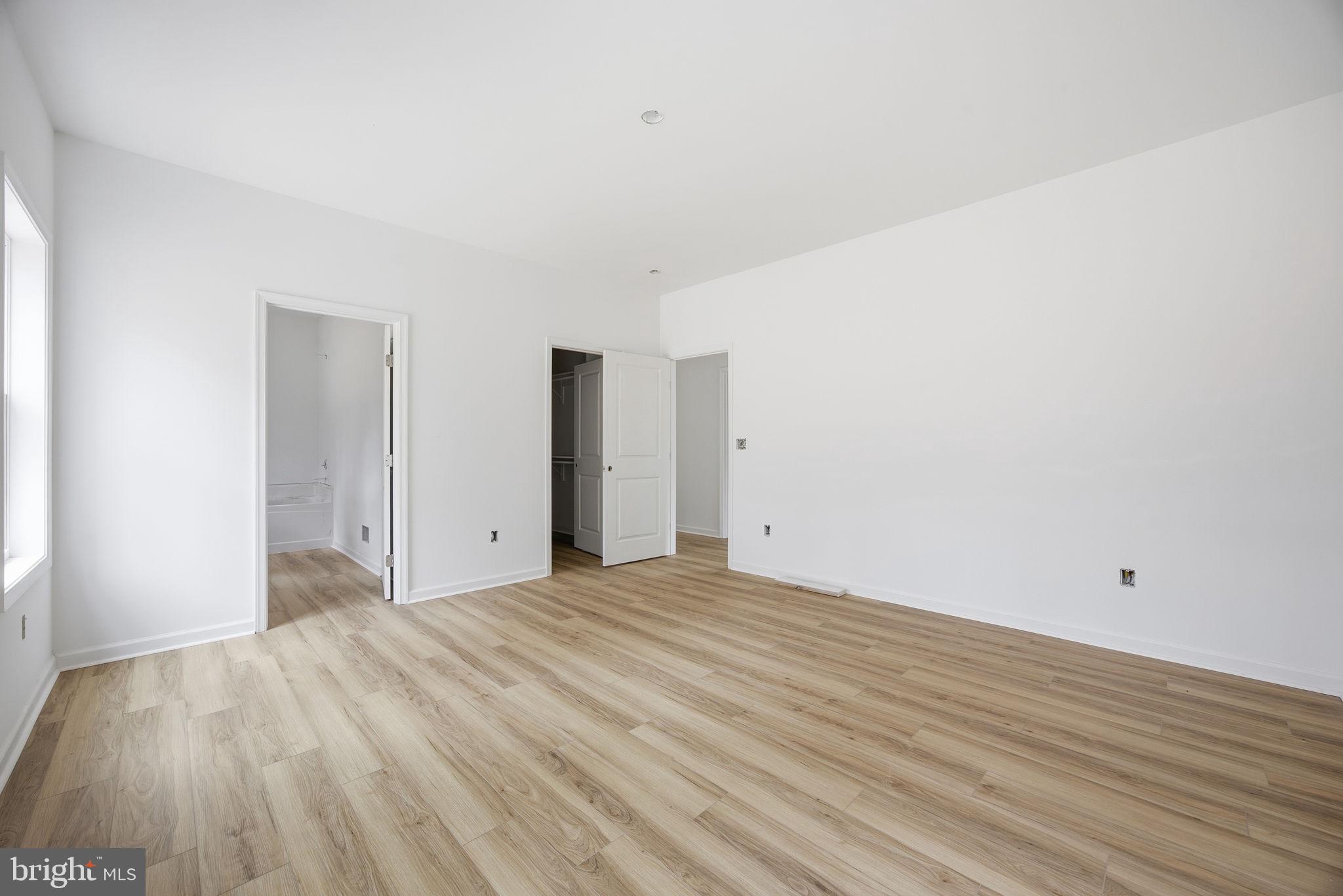 629 Providence Church Road Hedgesville, WV 25427 - Photo 41 of 54 a view of an empty room with wooden floor