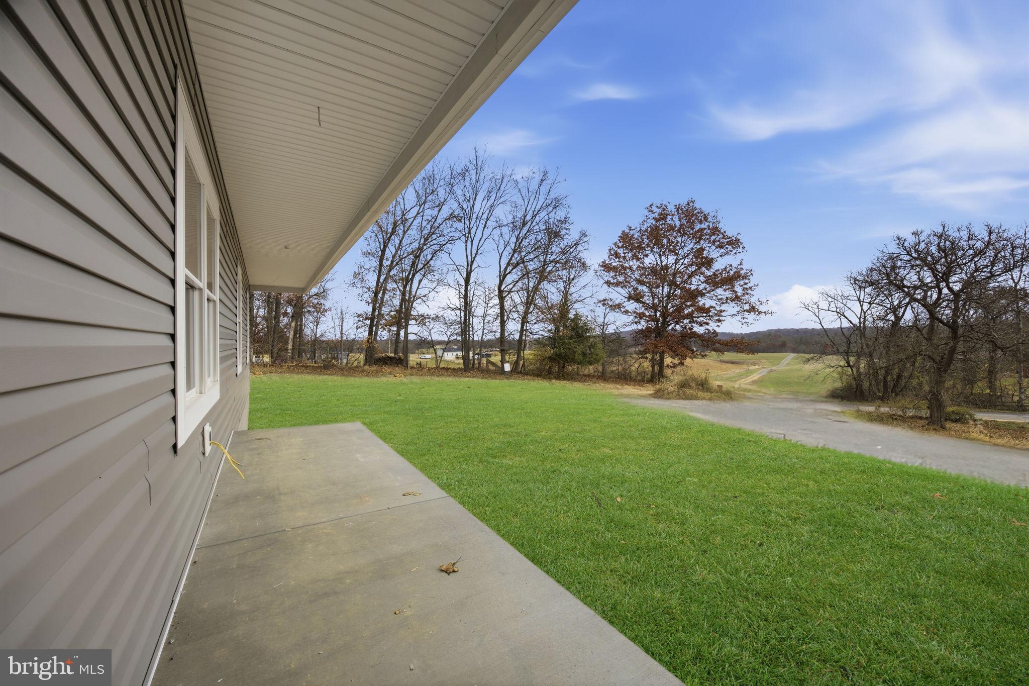 629 Providence Church Road Hedgesville, WV 25427 - Photo 7 of 54 a view of yard with swimming pool and green space