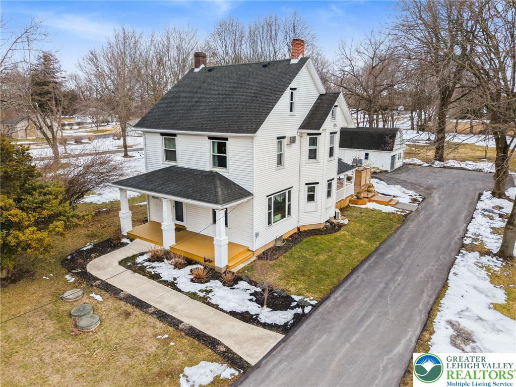 a aerial view of a house with a yard