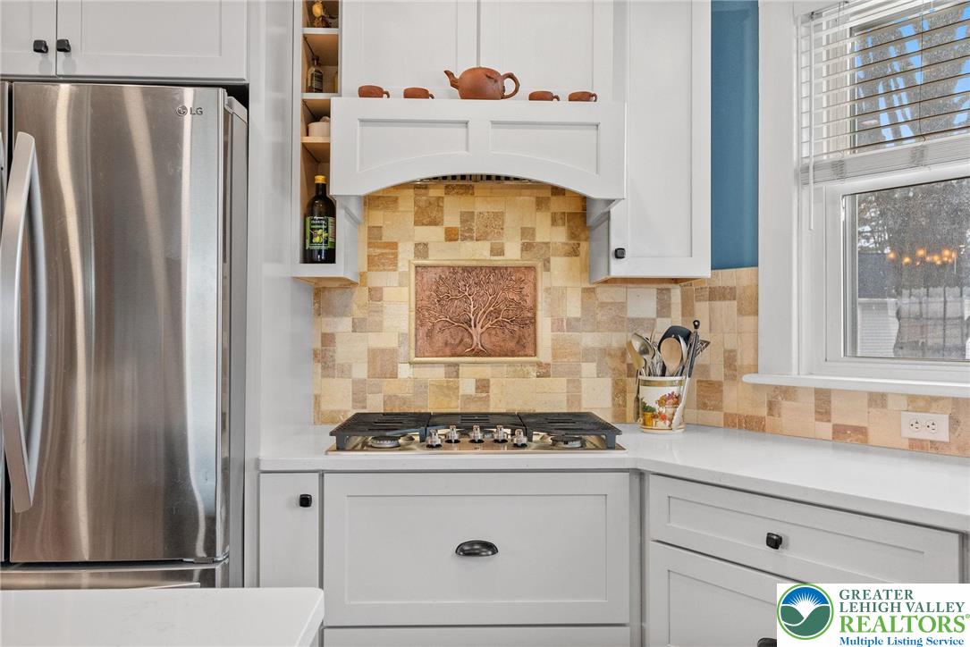 4303 Newburg Road Bethlehem, PA 18020 - Photo 14 of 63 a kitchen with a stove cabinets and a refrigerator