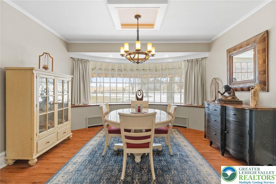 4303 Newburg Road Bethlehem, PA 18020 - Photo 18 of 63 a dining room with furniture a chandelier and wooden floor